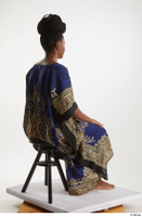  Dina Moses  1 dressed sitting traditional decora long african dress whole body 0004.jpg